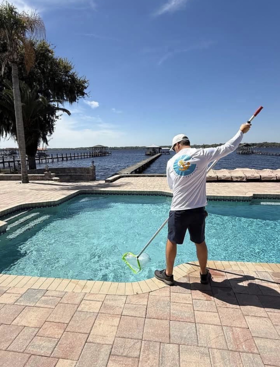 Salt and Key Pools technician servicing a pool